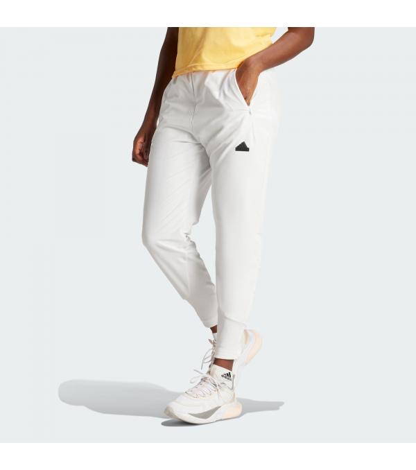 These woven pants from adidas move with you from morning Zen to a night out. Zip pockets offer you on-hand storage for essentials while ribbed cuffs keep hems in place, no matter your activity. WIND.RDY technology provides outstanding wind resistance, so let the day unfold however it may since these pants have you covered.By choosing recycled, adidas are able to reuse materials that have already been created, which helps to reduce waste. Renewable materials choices will help us to remove our reliance on finite resources. Our products made with a blend of recycled and renewable materials feature at least 70% total of these materials.Πληροφορίες• This model is 175 cm and wears a size 36. Their chest measures 80 cm and the waist 65 cm.• Contains a minimum of 70% recycled and renewable content• Regular fit with high rise• Elastic waist• 88% recycled polyester, 12% elastane doubleweave• Jersey lining• WIND.RDY• Front zip pockets• Ribbed cuffs• Z.N.E. screenprinted graphic on back leg• Χρώμα: WhiteΦροντίδα• Απαγορεύεται το λευκαντικό• Απαγορεύεται το στεγνό καθάρισμα• Στέγνωμα σε στεγνωτήριο σε χαμηλή θερμοκρασία• Μην χρησιμοποιείτε μαλακτικό• Χρησιμοποιήστε μόνο ήπιο απορρυπαντικό• Πλύσιμο από την ανάποδη με όμοια χρώματα• Απαγορεύεται το σιδέρωμα• Κρύο πλύσιμο στο πλυντήριο σε ήπιο πρόγραμμα για ευαίσθητα 