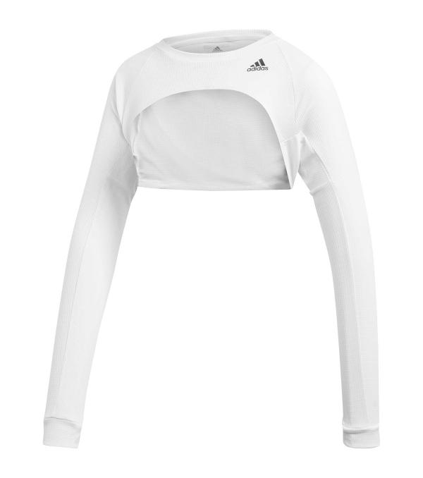 When the weather can't decide, keep your options open. Easy to pack, easy to pull on, this adidas tennis shrug lets you quickly cover up your shoulders and arms.