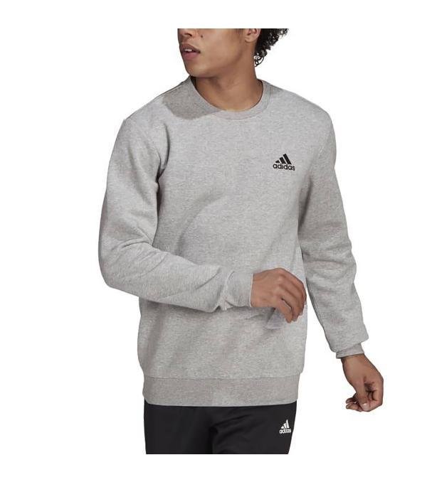 Warm, comfortable and a staple of any wardrobe. This adidas fleece sweatshirt has a ribbed crewneck for a classic look. Ribbed cuffs and hem make for a snug, secure fit. An adidas Badge of Sport on the chest completes the sporty and stylish look. By buying cotton products from us, you're supporting more sustainable cotton farming.