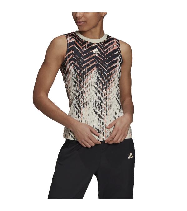 Honor the return of a legend. This adidas Primeblue Women's Tennis Tank mimics the Barricade herringbone outsole and makes a statement. The soft fabric and HEAT.RDY technology help you focus on the pitch when the volume is up. This stunning blouse catches the eye at the largest tennis tournament in North America.